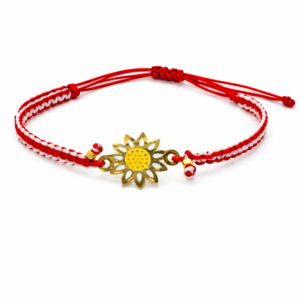 Χειροποίητο μαρτάκι με κόκκινο-λευκό πλεκτό κορδόνι και χρυσό λουλούδι.