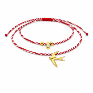 Χειροποίητο διπλό βραχιόλι μαρτάκι με κόκκινο-λευκό κορδόνι, χελιδόνι, ματάκι και διακοσμητικές λεπτομέρειες. Ρυθμιζόμενο, ιδανικό για δώρο Μαρτίου.
